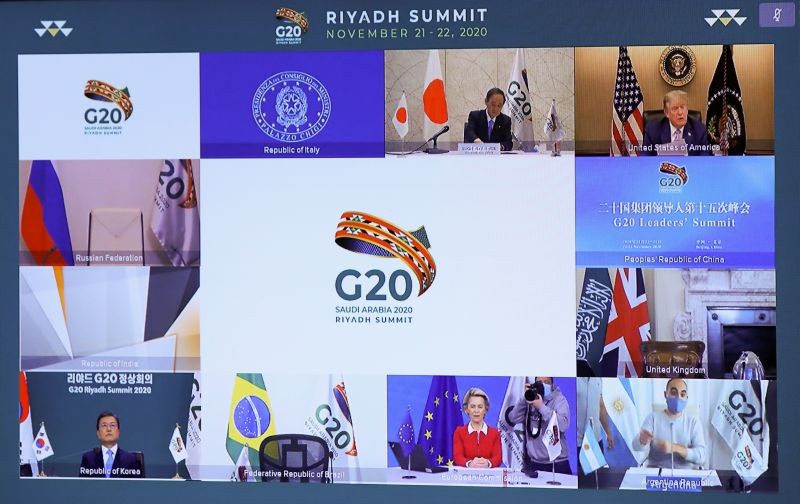 U.S. President Donald Trump, European Commission President Ursula von der Leyen, Japan's Prime Minister Yoshihide Suga and South Korean President Moon Jae-in are seen on a screen before the start of the virtual G20 meeting hosted by Saudi Arabia, amid the coronavirus disease (COVID-19) outbreak, in Brussels, Belgium November 21, 2020. (REUTERS Photo)