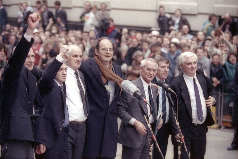 Aquitted members of the Birmingham Six, sent to prison in 1975 for the IRA's bombing of two pubs, gather with their MP after they walk from court as free men.  (REUTERS File Photo)