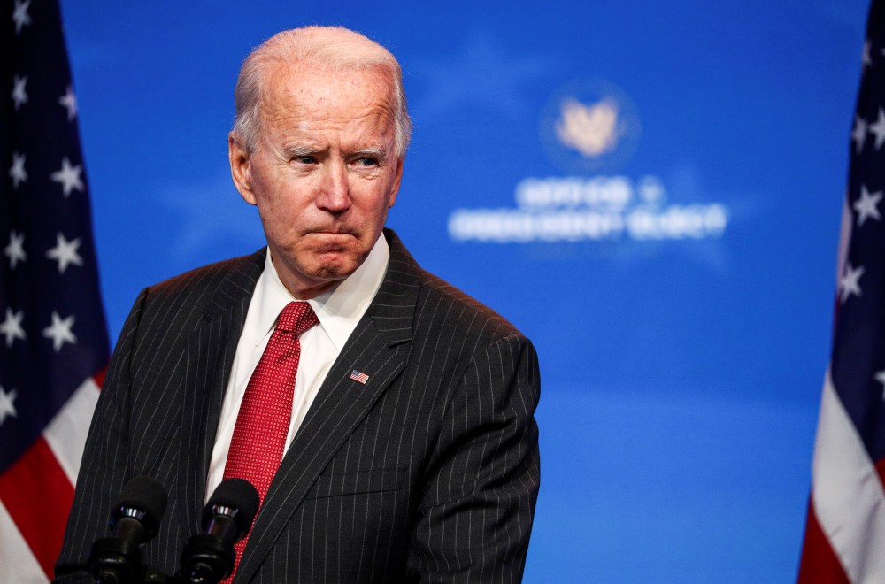 U.S. President-elect Joe Biden speaks to reporters following an online meeting with members of the National Governors Association (NGA) executive committee in Wilmington, Delaware, U.S., November 19, 2020. REUTERS/Tom Brenner/File Photo