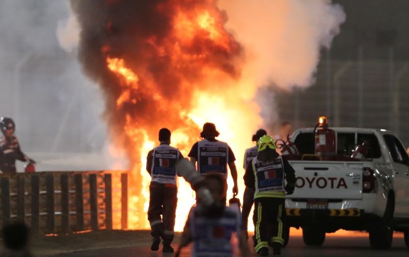 Formula One F1 - Bahrain Grand Prix - Bahrain International Circuit, Sakhir, Bahrain - November 29, 2020 Flames seen from the crash scene after Haas' Romain Grosjean crashed out at the start of the race Pool via REUTERS/Kamran Jebreili