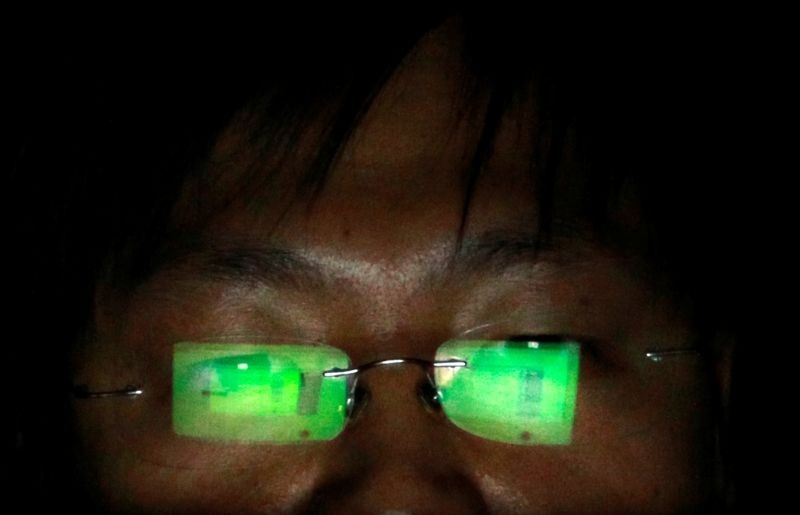 A hacker, who asked not to have his name revealed, works on his laptop in his office in Taipei July 10, 2013. (REUTERS File Photo)