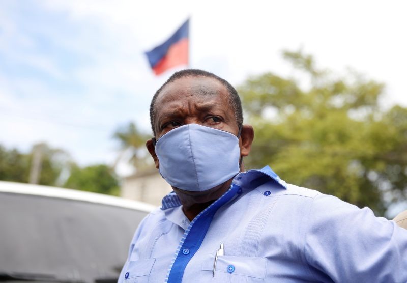 FILE PHOTO: Yves Jean-Bart, president of the Haitian Football Federation, wearing a protective face mask arrives at his hearing at the Crois-Des-Bouquets prosecutor's office, after being accused of sexually abusing young footballers at the country's national training centre, Crois-Des-Bouquets, Haiti, May 14, 2020. REUTERS/Jeanty Junior Augustin/File Photo