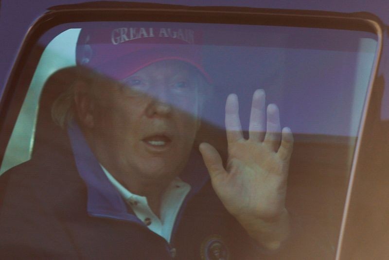 U.S. President Donald Trump waves to supporters as he drives past Freedom Plaza as he returns to the White House after playing golf in Washington, U.S., November 14, 2020. (REUTERS Photo)