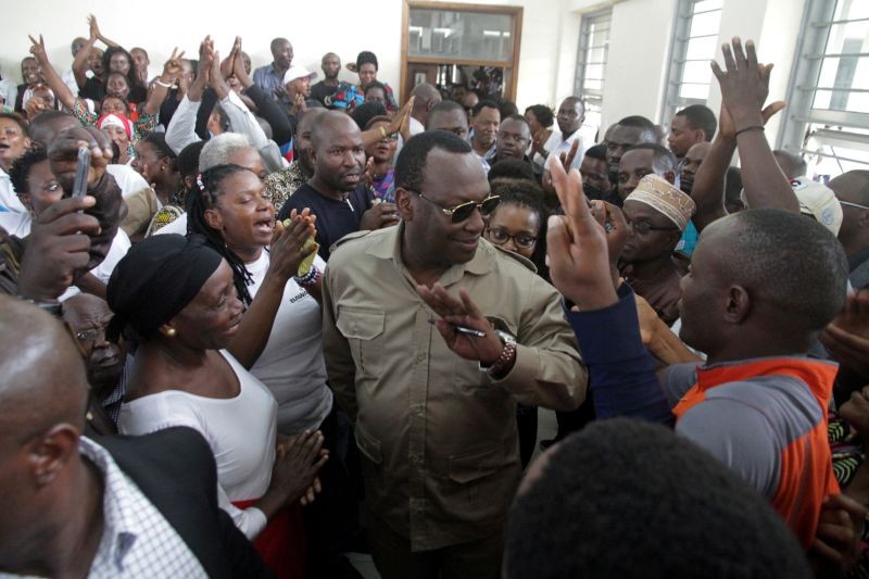 FILE PHOTO: Freeman Mbowe (C), chairman of Chadema, Tanzanian main opposition party arrives at Kisutu Magistrate Court in Dar es Salaam, Tanzania March 10, 2020. REUTERS/Emmanuel Herman/File Photo