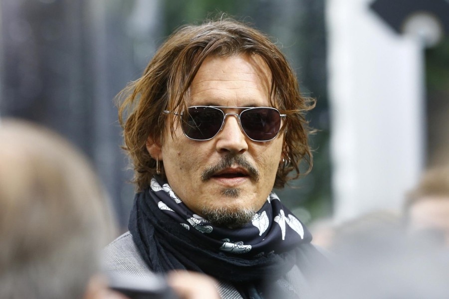 FILE PHOTO: Actor Johnny Depp talks to the media before a screening of the documentary movie he produced: "Crock of gold: A few rounds with Shane McGowan" at the 16th Zurich Film Festival (ZFF) in Zurich, Switzerland October 2, 2020. REUTERS/Arnd Wiegmann