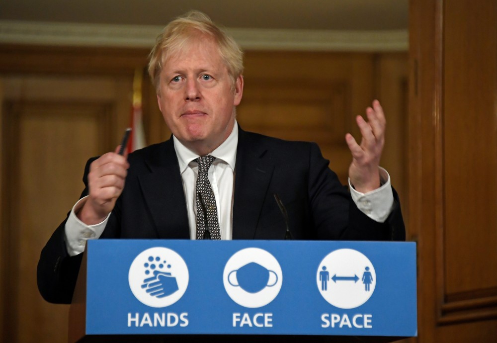 Britain's Prime Minister Boris Johnson gestures as he speaks during a press conference at 10 Downing Street in London on October 31. ( Alberto Pezzali/Pool via REUTERS)