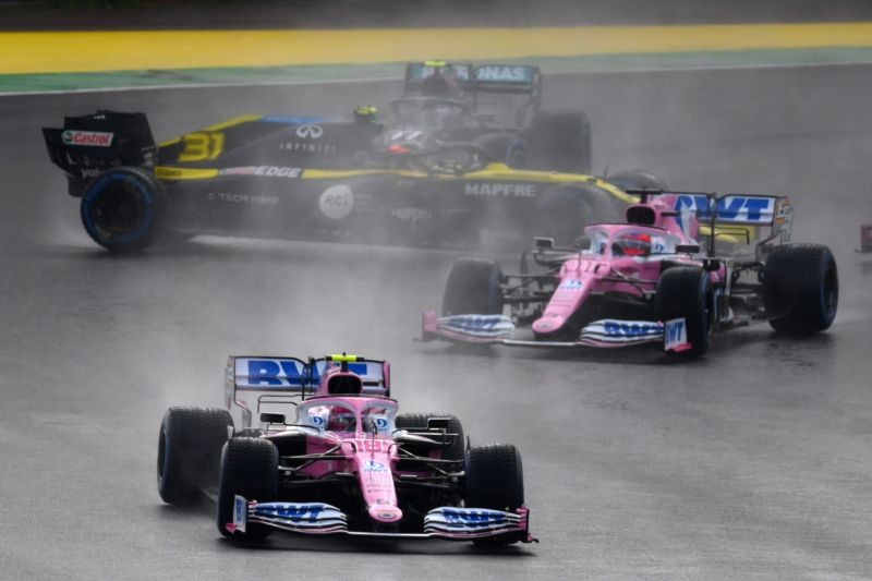 Racing Point's Lance Stroll leads Racing Point's Sergio Perez as Renault's Esteban Ocon and Mercedes' Valtteri Bottas spin at the start of the race REUTERS/Clive Mason