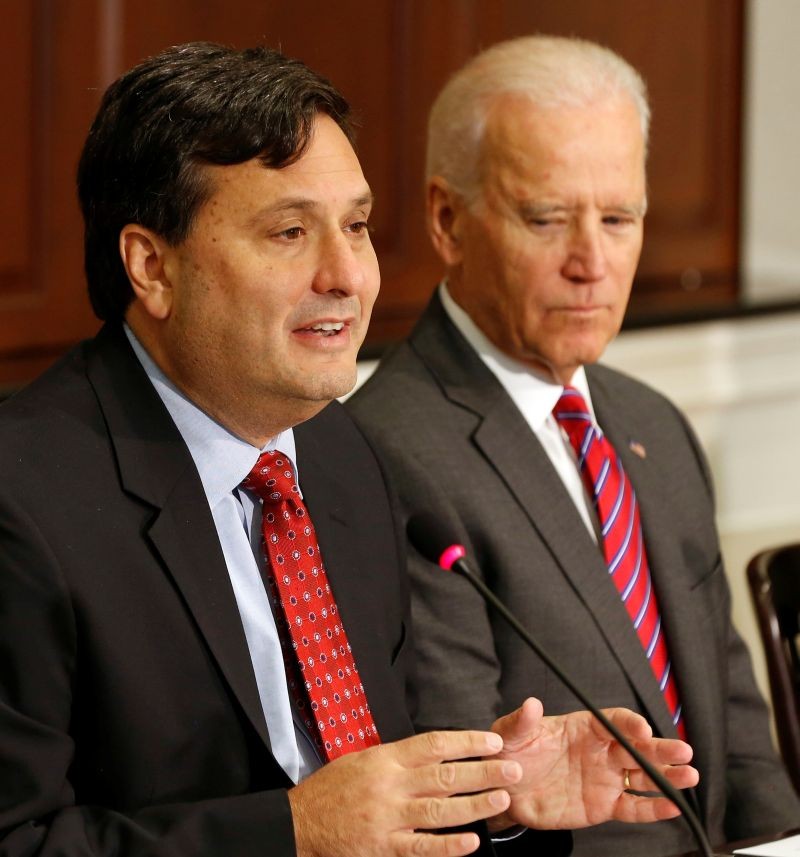 U.S. Vice President Joe Biden (R) listens to Ebola Response Coordinator Ron Klain (L) speak to organization leaders that are responding to the Ebola crisis, while in the Eisenhower Executive Office Building on the White House complex in Washington, November 13, 2014. (REUTERS File Photo)