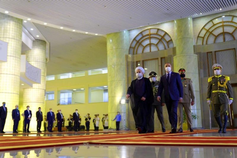 Iranian President Hassan Rouhani welcomes Iraqi Prime Minister Mustafa al-Kadhimi as they wear protective masks, in Tehran, Iran, July 21 2020. (REUTERS File Photo)