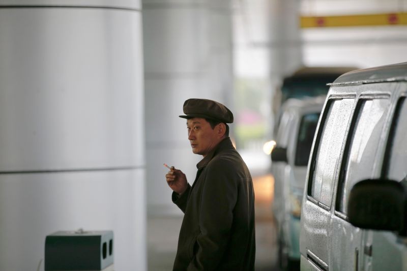 A man smokes a cigarette outside the airport in Pyongyang, North Korea May 3, 2016.  (REUTERS File Photo)
