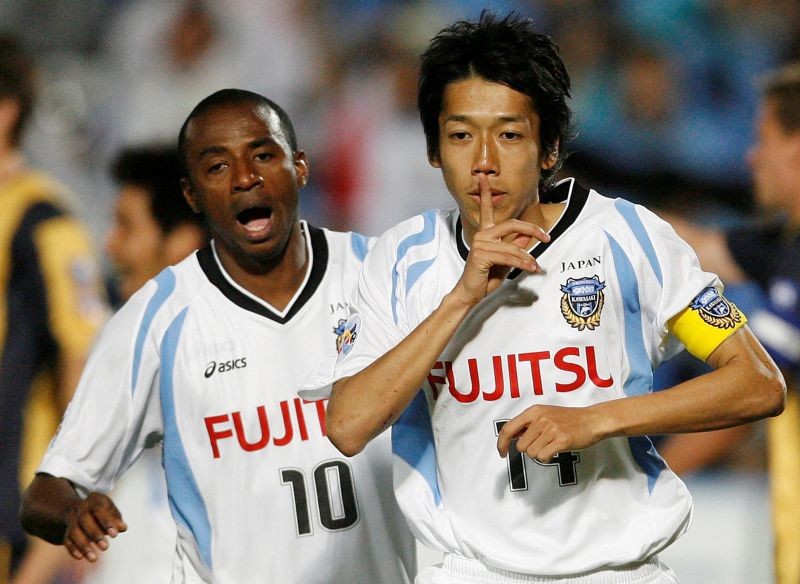 FILE PHOTO: Kawasaki Frontale's Nakamura Kengo (R) celebrates scoring against the Central Coast Mariners as team mate Juninho runs behind during their AFC Champions League Group H match at Central Coast Stadium in Gosford, April 8, 2009. REUTERS/Daniel Munoz/File Photo