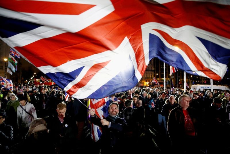 A man waves a British flag on Brexit day in London, Britain, January 31, 2020. (REUTERS File Photo)