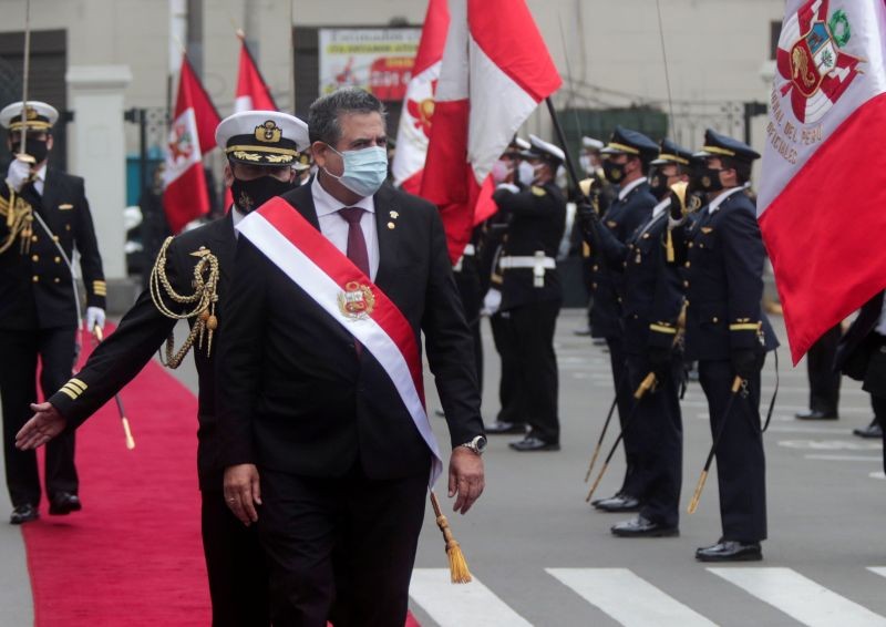 Peru's interim President Manuel Merino reviews an honour guard after he was sworn in following the removal of President Martin Vizcarra by lawmakers, in Lima, Peru November 10, 2020.  (REUTERS Photo)