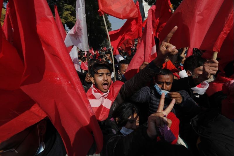 Nepalese supporters of the splinter group in the governing Nepal Communist Party participate in a protest in Kathmandu, Nepal on December 29, 2020. Tens of thousands of supporters of the splinter group rallied in the capital on Tuesday demanding the ouster of the prime minister and the reinstatement of the Parliament he dissolved amid an escalating feud in the party. (AP/PTI Photo)