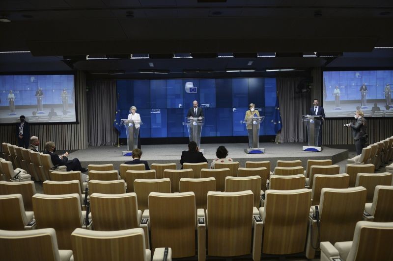 From left on podium, European Commission President Ursula von der Leyen, European Council President Charles Michel and German Chancellor Angela Merkel participate in a media conference at an EU summit in Brussels, Friday, Dec. 11, 2020. European Union leaders have reached a hard-fought deal to cut the bloc's greenhouse gas emissions by at least 55 percent by the end of the decade compared with 1990 levels, avoiding a hugely embarrassing deadlock ahead of a U.N. climate meeting this weekend. (AP/PTI)