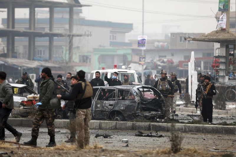 Afghan security personnel inspect the site of a bombing attack in Kabul, Afghanistan on December 20, 2020. The strong car bomb explosion rocked the capital Kabul city on Sunday morning, killing multiple people, said a government official. (AP/PTI Photo)