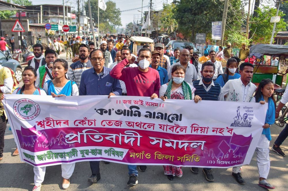 Nagaon: Members of Asom Jatiyatabadi Yuba Chatra Parishad (AJYCP) take part in a protest rally against the Citizenship Amendment Act (CAA), in Nagaon District of Assam, Friday, Dec. 11, 2020. (PTI Photo)