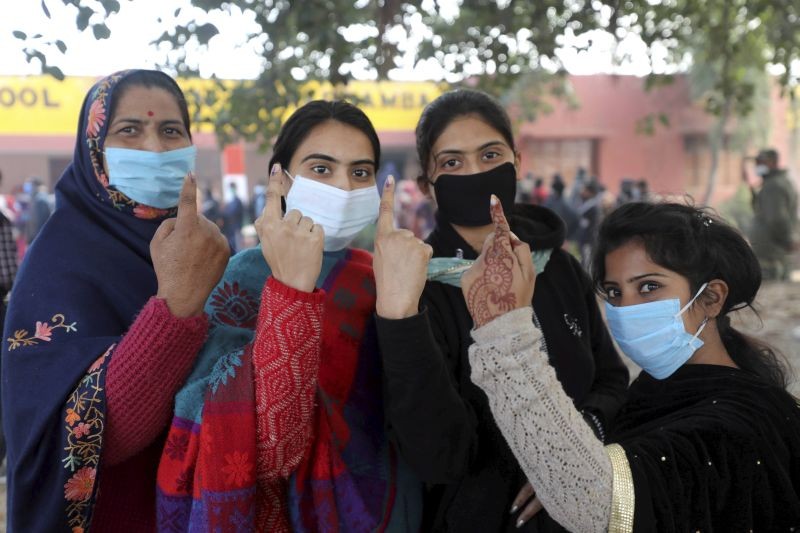 Jammu: Voters show their fingers marked with indelible ink after casting their votes during the second phase of the District Development Council (DDC) election at Meen Sarkar Sambha in Jammu, Tuesday, Dec. 1, 2020. (PTI Photo)