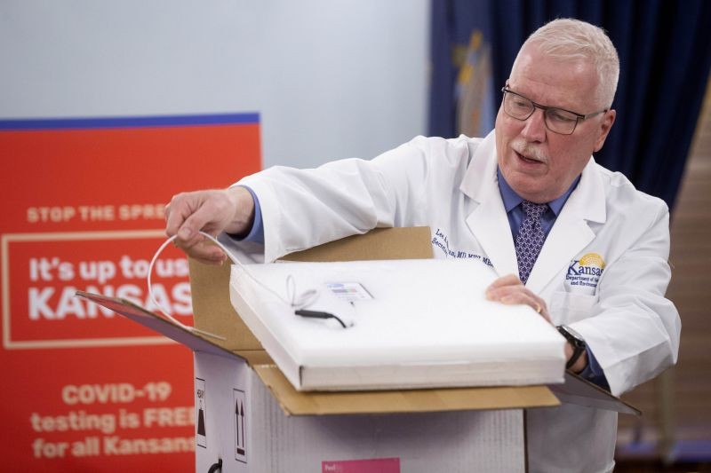 Kansas secretary of health and environment Lee Norman shows the sophisticated packaging of the Pfizer COVID-19 vaccine during a news conference on December 9, 2020 at the Statehouse in Topeka, Kan.  (AP/PTI File Photo)