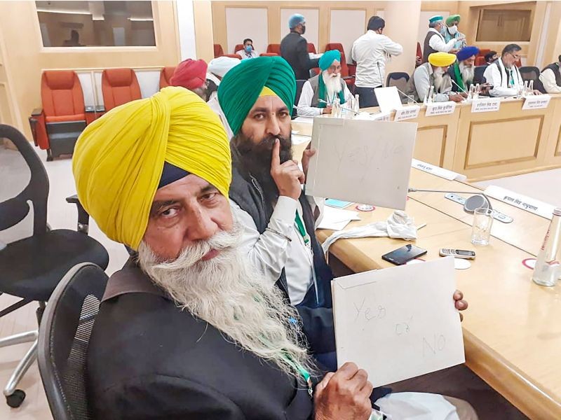 Representatives of various farmer unions on a 'maun vrat' (vow of silence), during their fifth round of talks with the government on the three new farm laws, in New Delhi on December 5. (PTI Photo)