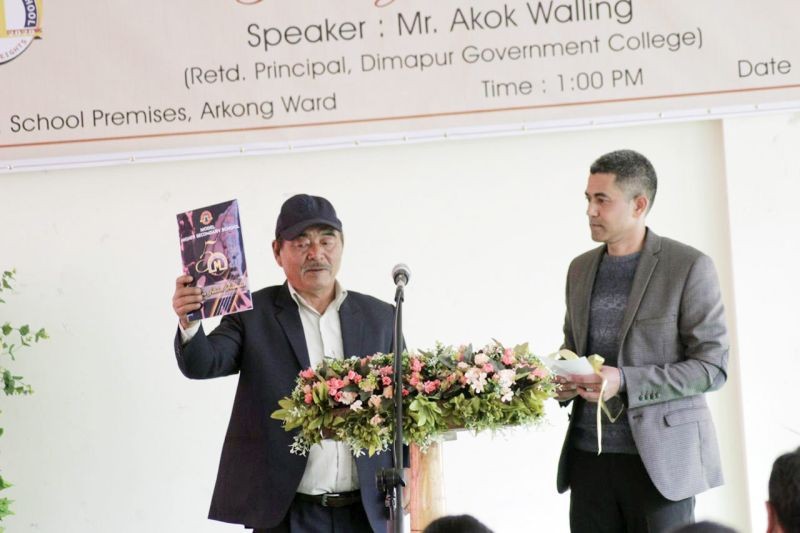 Lanukaba Imchen, Former Chairman of the Education Board (MHSS), releasing theMHSS Jubilee Souvenir at the Golden Jubilee celebration of Model Higher Secondary School, Mokokchung on December 11. (Morung Photo)