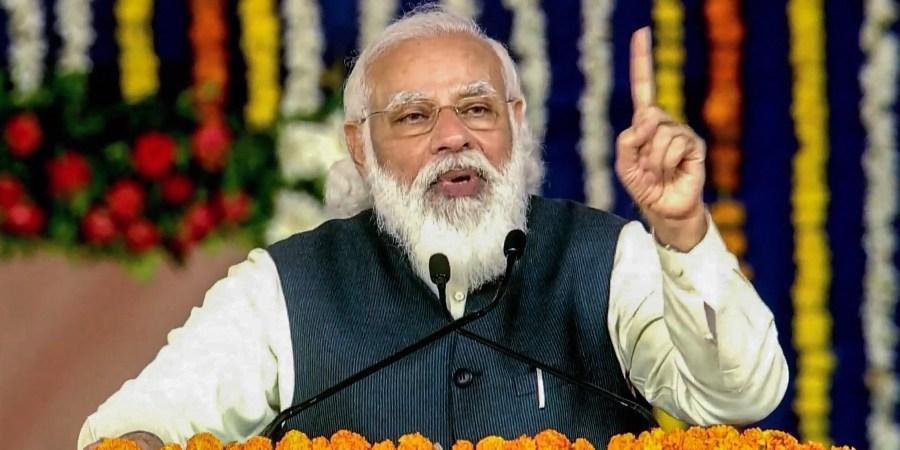 Prime Minister Narendra Modi addresses at the foundation stone laying ceremony of development projects in Kutch Tuesday. (Photo | PTI)