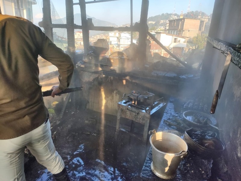 Fire Personnel can be seen fighting fire at Arkong Ward, Mokokchung on December 15.