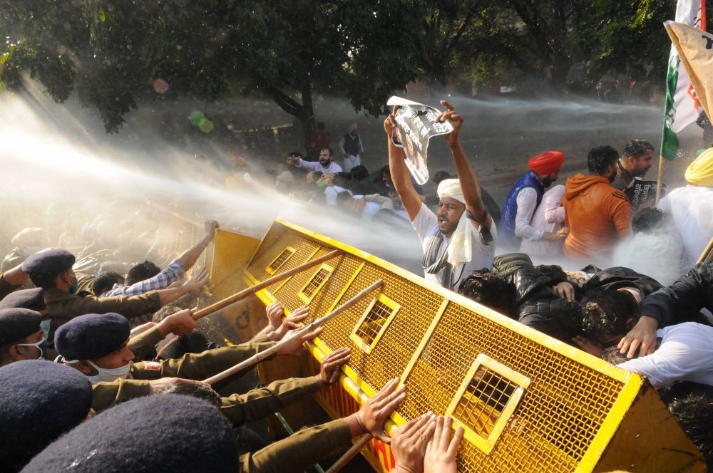 Police use water cannons and barricades to stop Youth Congress workers who were marching towards Haryana CM Manohar Lal's residence in protest over new farm laws, in Chandigarh, Wednesday, Dec. 2, 2020. (PTI Photo)