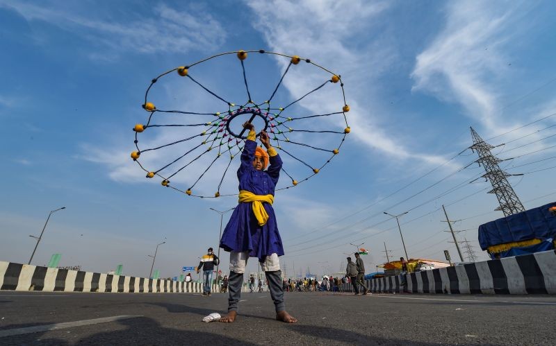 A young sikh practices 'gatka' during farmers' sit-in protest against the Centre's farm reform laws, at Delhi-UP border in Ghaziabad on December 20, 2020. (PTI Photo)