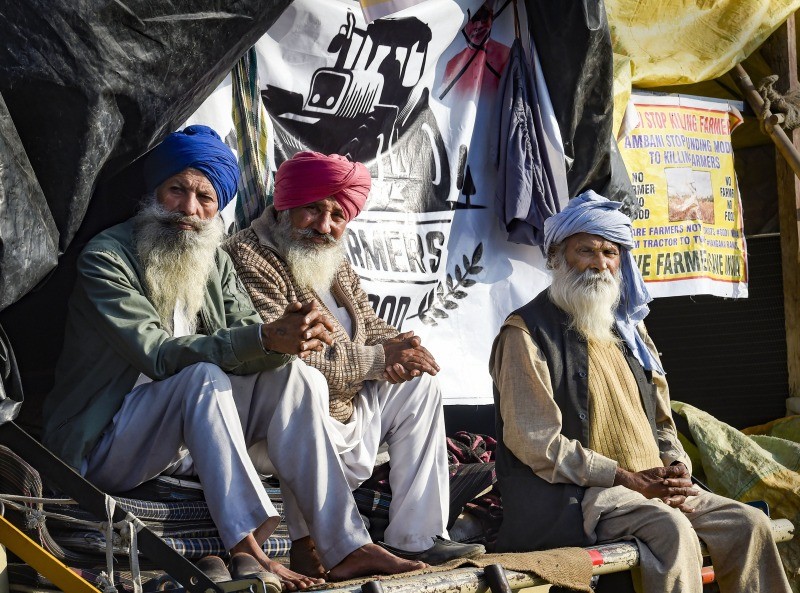 Farmers protest against the new farm laws, at Singhu border in New Delhi on December 13. (PTI Photo)