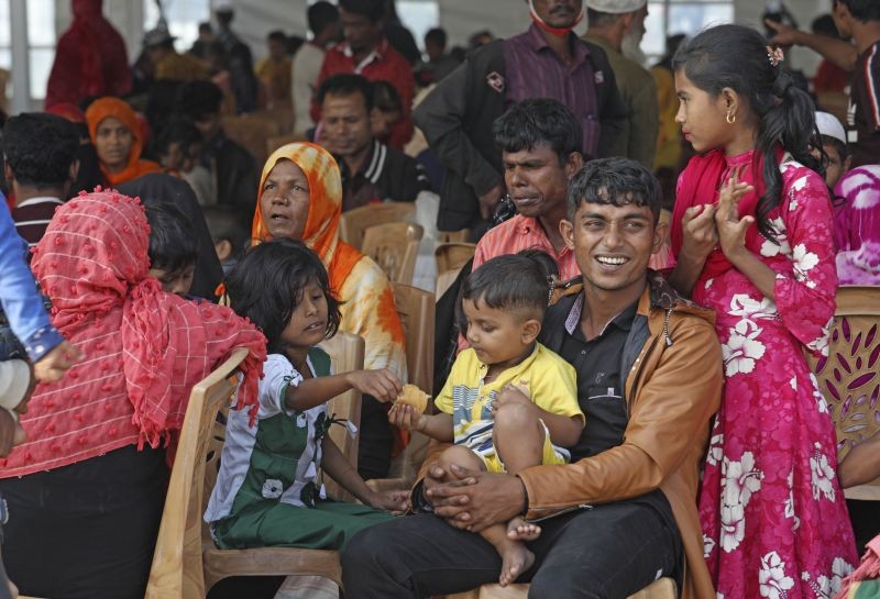 Rohingya refugees wait to be transported on a naval vessel to Bhashan Char, or floating island, in the Bay of Bengal, from Chittagong, Bangladesh on December 4, 2020. (AP/PTI Photo)