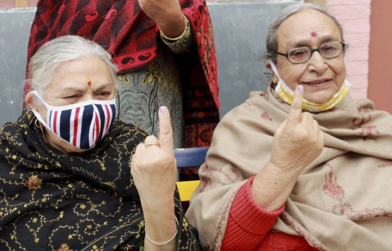 Jammu: Kashmiri Pandit migrants show their fingers marked with indelible ink after casting their votes for the third phase of the District Development Council (DDC) elections, in Jammu, Friday, Dec. 4, 2020. (PTI Photo)