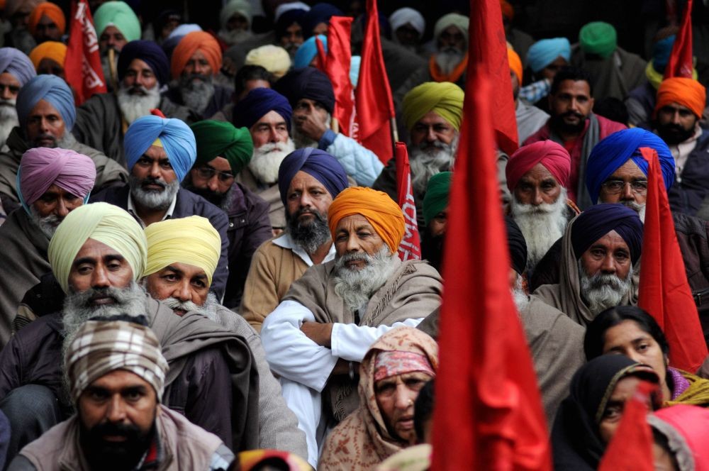 Amritsar: Members of various farmer unions participate in a protest against the Centre's farm reform laws, outside the Deputy Commissioner (DC) office in Amritsar, Monday, Dec. 14, 2020. (PTI Photo)