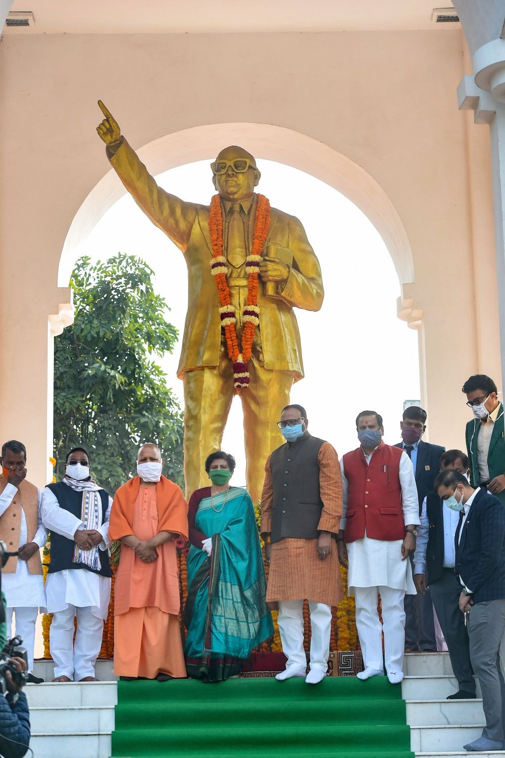 Lucknow: Uttar Pradesh Chief Minister Yogi Adityanath pays tribute to Baba Bhimrao Ambedkar on his 64th death anniversary, at Ambedkar Mahasabha in Lucknow, Sunday, Dec. 6, 2020. (PTI Photo/Nand Kumar)