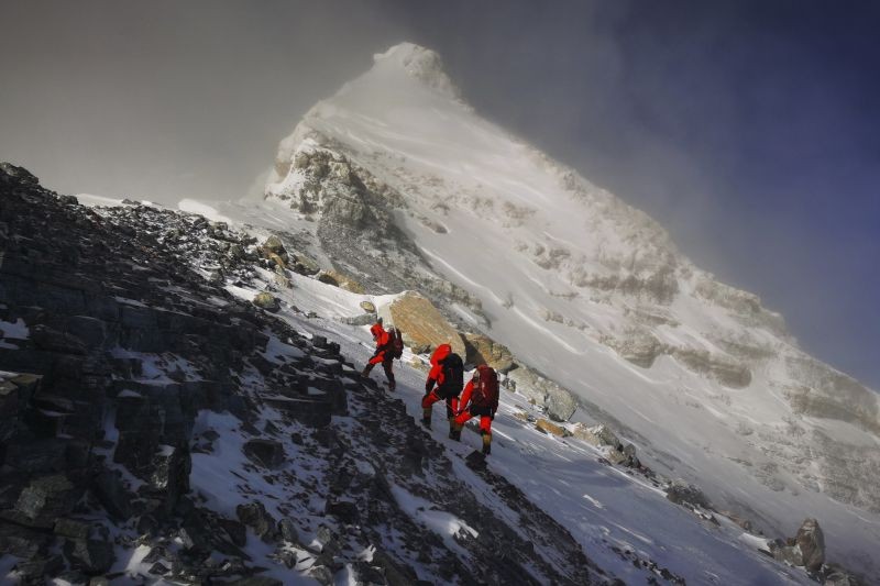 In this May 27, 2020, file photo released by Xinhua News Agency, members of a Chinese surveying team head for the summit of Mount Everest, also known locally as Mt. Qomolangma. China and Nepal have jointly announced on Tuesday, Dec. 8, 2020, a new height for Mount Everest, ending a discrepancy between the two nations. (AP/PTI File Photo)
