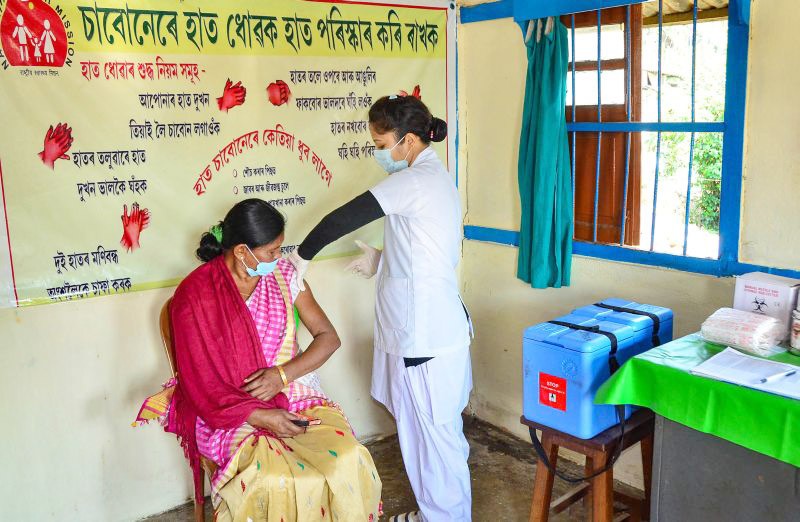 A medic demonstrates administration of COVAXIN, an Indian government-backed experimental COVID-19 vaccine, to a health worker during its trials, at the Urban Primary Health Centre at Tezpur on December 29. Dry run has been conducted successfully in four states of Andhra Pradesh, Assam, Gujarat and Punjab. (PTI Photo)