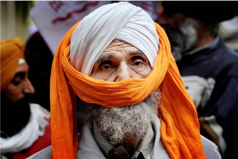 A farmer participates in a protest against the Centre's farm reform laws, outside the Deputy Commissioner (DC) office in Amritsar on December 14. (PTI Photo)