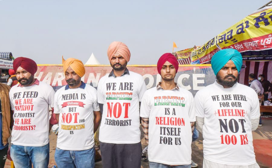 Farmers during their agitation against the Center's new farm laws, at Singhu border in New Delhi on December 7. (PTI Photo)