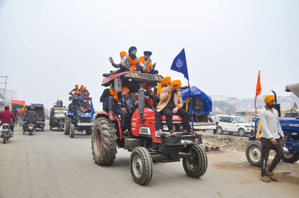 Sonipat: Farmers ride tractors during their protest march against the new farm laws, at Kundli border in Sonipat, Saturday, Dec. 12, 2020. (PTI Photo)