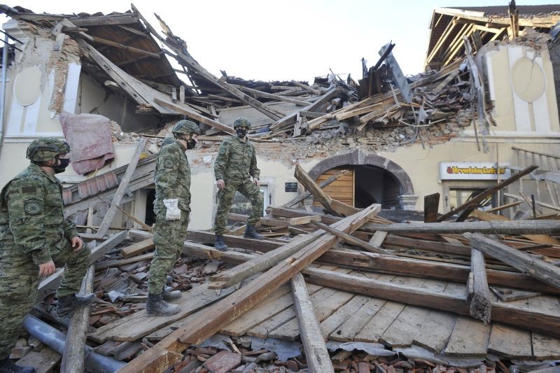 Soldiers inspect remains of a building damaged in an earthquake, in Petrinja, Croatia on December 29, 2020. A strong earthquake has hit central Croatia and caused major damage and at least one death in a town southeast of the capital. (AP/PTI Photo)