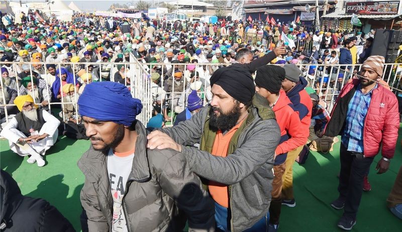 People with visual impairment join farmers' sit-in protest against the Centre's farm reform laws, at Singhu border in New Delhi on December 19. (PTI Photo)
