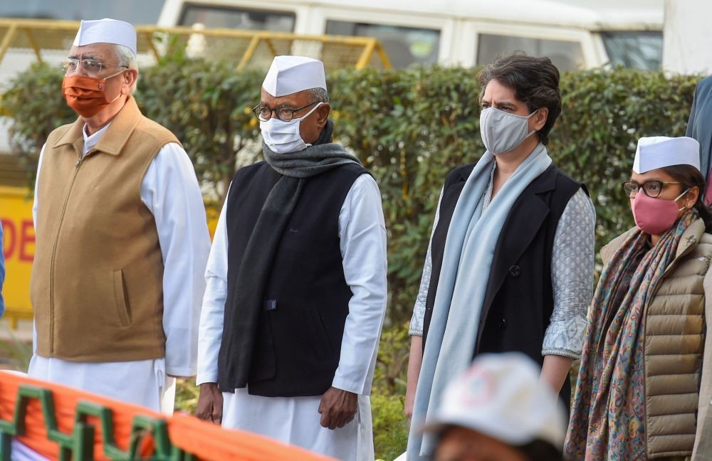 New Delhi: Congress leaders Priyanka Gandhi Vadra, Digvijaya Singh, and others during the flag hoisting ceremony on party's 136th foundation day at AICC HQ in New Delhi, Monday, Dec. 28, 2020. (PTI Photo/Atul Yadav
