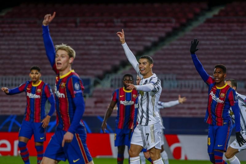 Barcelona : Juventus' Cristiano Ronaldo, center, gestures during the Champions League group G soccer match between FC Barcelona and Juventus at the Camp Nou stadium in Barcelona, Spain, Tuesday, Dec. 8, 2020.  AP/PTI