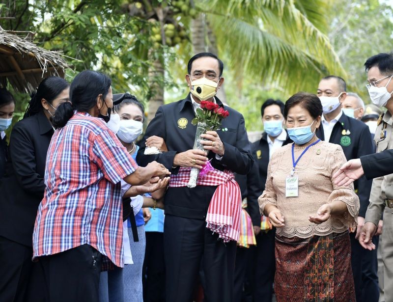 In this photo released by Government Spokesman Office, Thailand's Prime Minister Prayuth Chan-ocha receives flowers from well wishers in Samut Songkhram province, Thailand on December 2. (AP/PTI Photo)