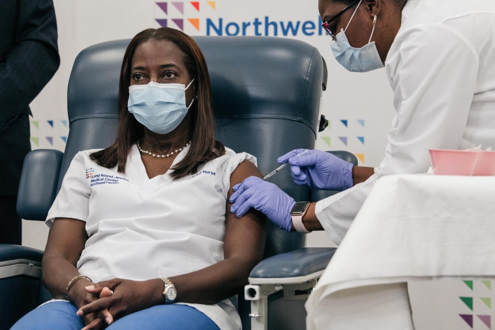 Sandra Lindsay, a critical care nurse at New York's Long Island Jewish Medical Center, was among the first people to receive the first dose of the Pfizer/BioNTech COVID-19 vaccine on December 14. (Photo Courtesy: @NYGovCuomo / Twitter)