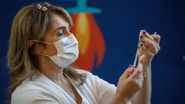 A medical staff member prepares a Covid-19 vaccine. (AP)