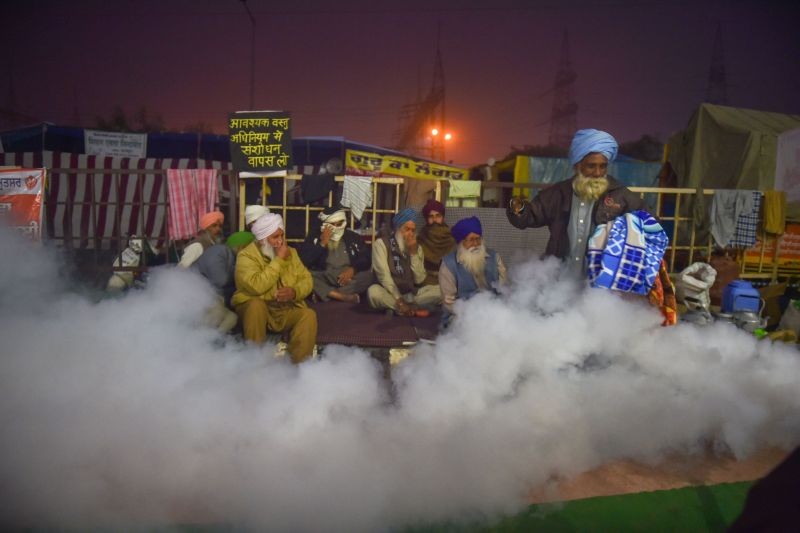Fumigation at Ghazipiur border as farmers stage a protest against the Centre's farm reform laws, near Ghazipur border in New Delhi on December 12. (PTI Photo)
