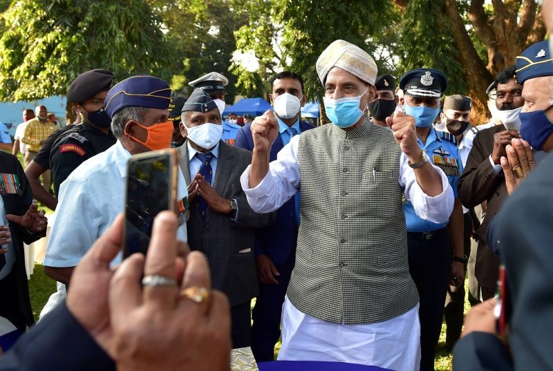 Union Defence Minister Rajnath Singh, wearing a Mysuru peta, greets veterans as he attends the 5th Armed Forces Veteran's Day, in Bengaluru on January 14, 2021. (PTI Photo)