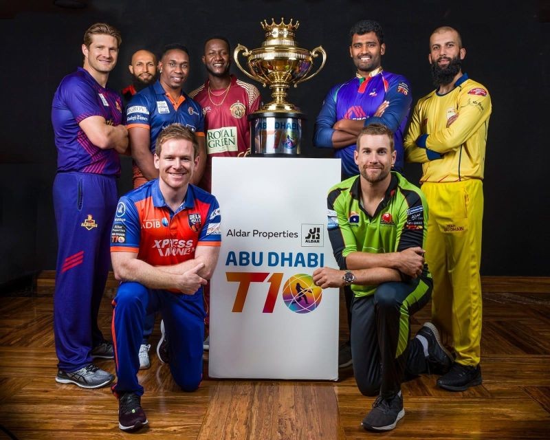 Team Abu Dhabi captain Moeen Ali, Maratha Arabians captain Dwayne Bravo, Bangla Tigers captain Thisara Perera, Deccan Gladiators captain Shane Watson, Delhi Bulls captain Eoin Morgan, Northern Warriors captain Darren Sammy and Karnataka Tuskers captain Hashim Amla unveil the Trophy at the opening ceremony of the 10-day Abu Dhabi T10 tournament. (IANS Photo)