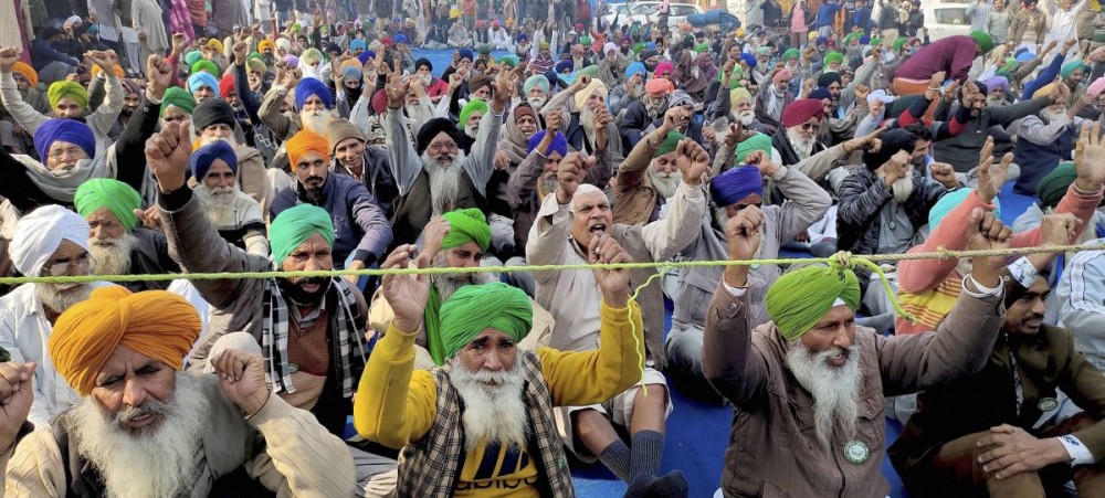 Farmers stage a protest against Centres farm reform laws at Tikri border, in New Delhi. Photograph: PTI Photo